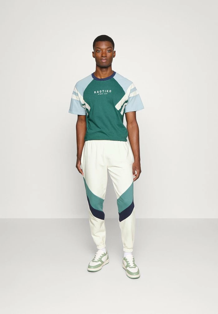 PANTALON CHANDAL RETRO ATHLETIC UNISEX - Tracksuit bottoms - marfil/heura/navy Kaotiko PANTALON CHANDAL RETRO ATHLETIC UNISEX - Tracksuit Bottoms - Marfil/heura/navy -Kaotiko Shop 19a013965b694458a06f571422fac4d4