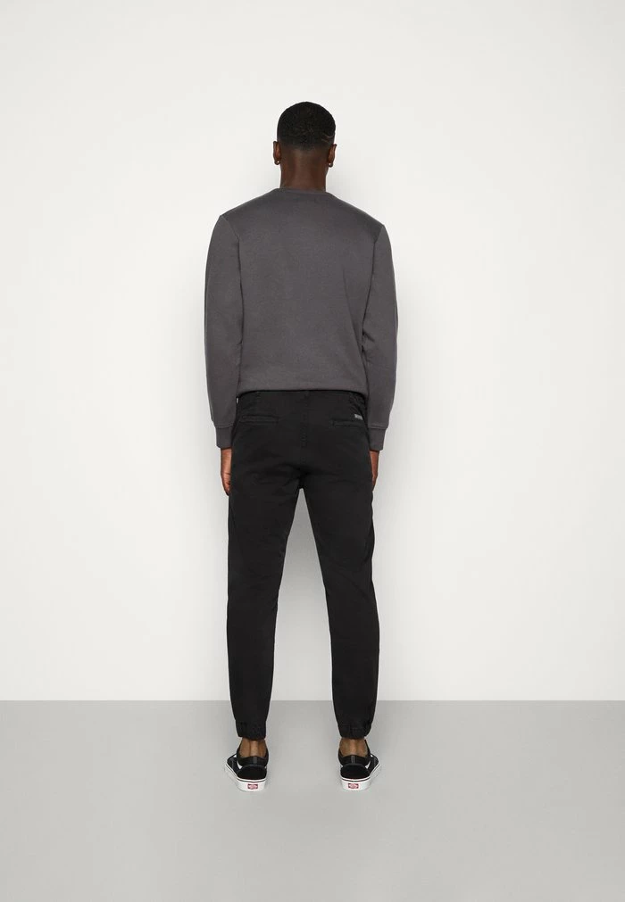 PANT ILLINOIS UNISEX - Chinos - black Kaotiko PANT ILLINOIS UNISEX - Chinos - Black -Kaotiko Shop 22c400f749664f8faffee2acc42db161