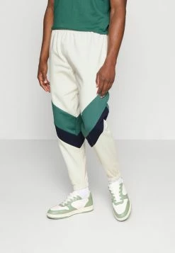 Kaotiko PANTALON CHANDAL RETRO ATHLETIC UNISEX - Tracksuit Bottoms - Marfil/heura/navy