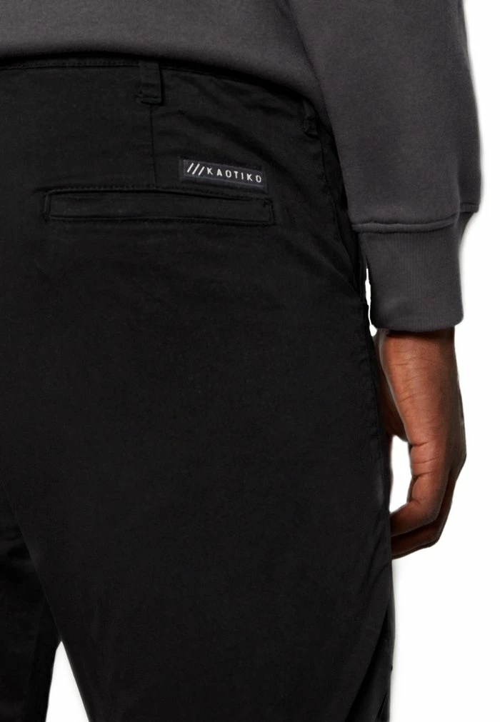 PANT ILLINOIS UNISEX - Chinos - black Kaotiko PANT ILLINOIS UNISEX - Chinos - Black -Kaotiko Shop 6c8e1bdf1d134c9893977602681f9af7